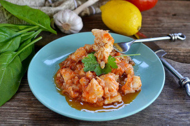 Fish in tomato sauce with onions and stewed carrots