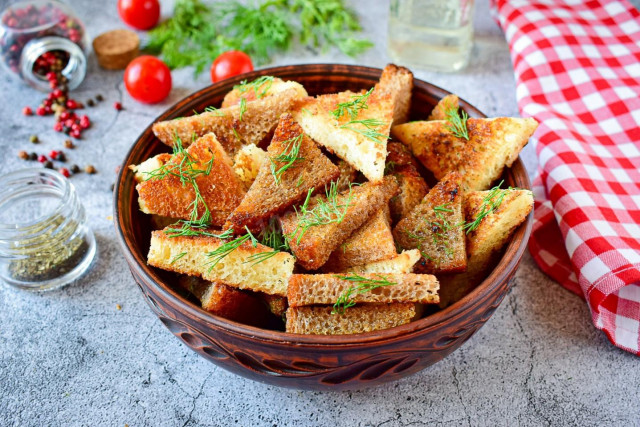 Croutons with garlic in a frying pan
