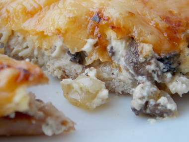Chop with mushrooms and pork cheese in the oven