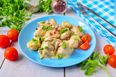 Chicken in sour cream sauce in a frying pan