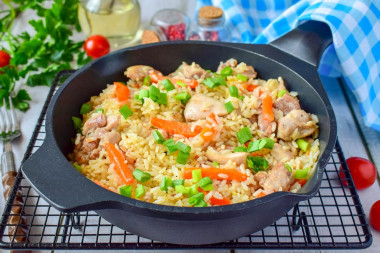 Rice with chicken in a frying pan