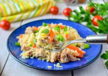 Rice with chicken in a frying pan