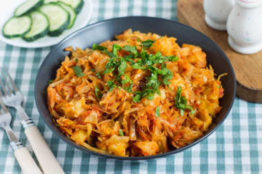 Stewed cabbage with potatoes in a frying pan