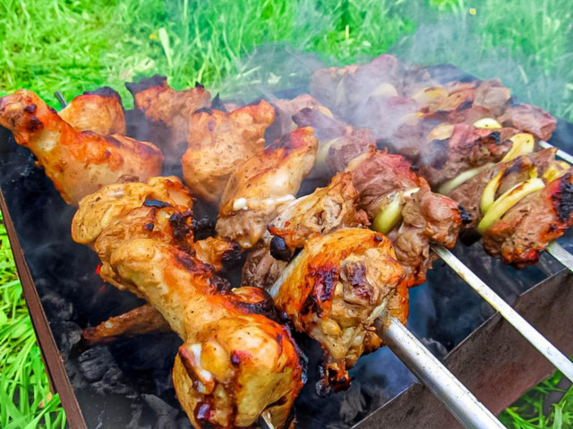 Shish kebab with mustard from chicken juicy on the grill