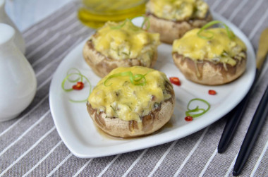 Mushrooms stuffed with chicken and cheese in the oven