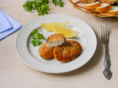 Pike fish cutlets with bacon in a frying pan