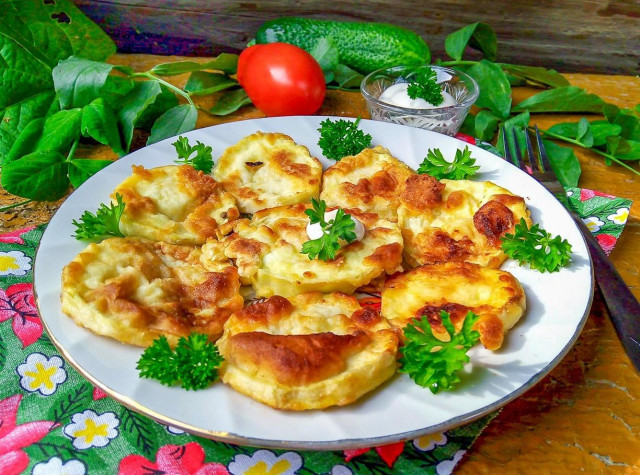 Zucchini with egg in a frying pan