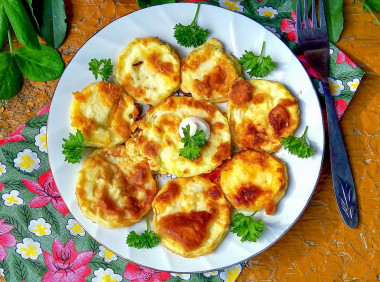 Zucchini with egg in a frying pan