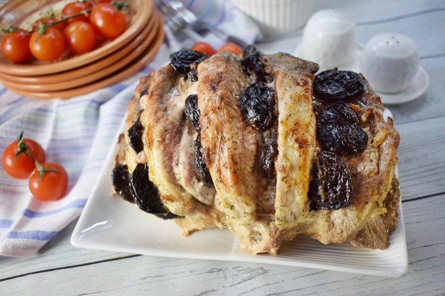 Pork with prunes in marinade in the oven in foil