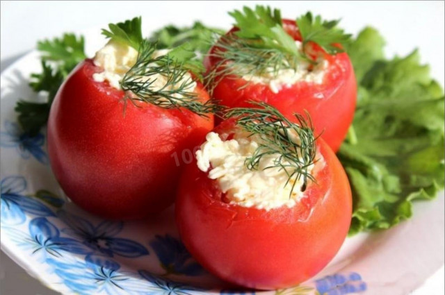 Tomatoes stuffed with herbs, processed cheese and garlic