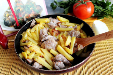 Pork and potatoes in a frying pan