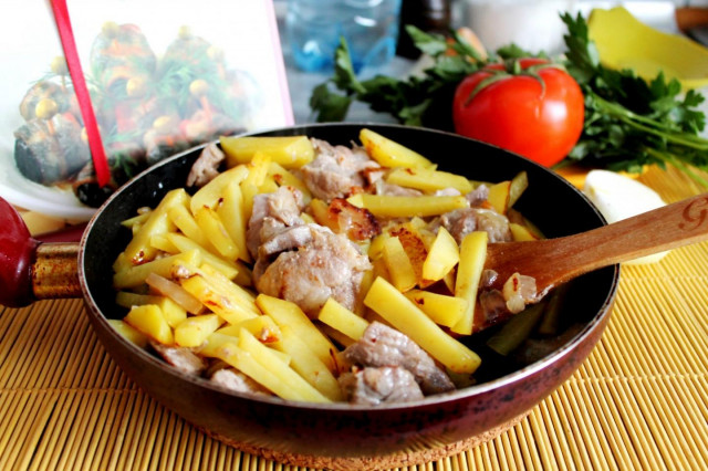 Pork and potatoes in a frying pan