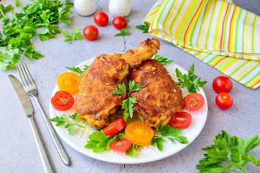 Chicken in breadcrumbs in a frying pan