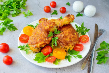 Chicken in breadcrumbs in a frying pan