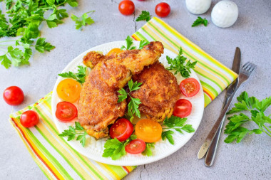 Chicken in breadcrumbs in a frying pan