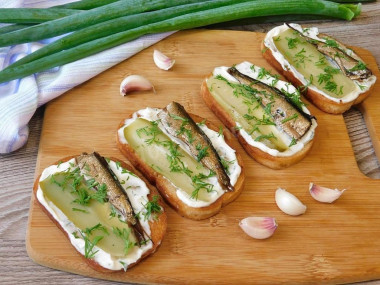 Sandwiches with sprats and pickled cucumber