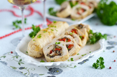 Chicken rolls with mushrooms and cheese in the oven