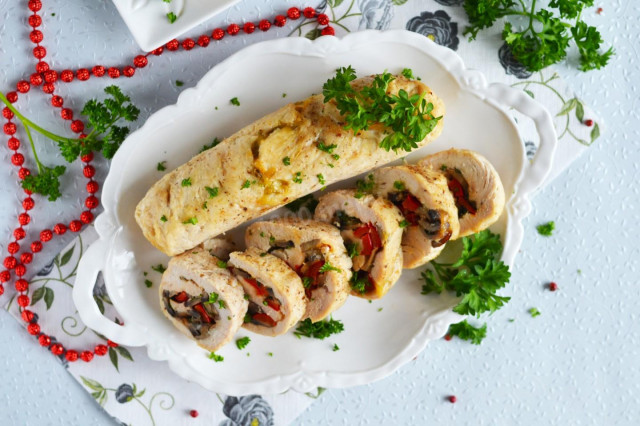Chicken rolls with mushrooms and cheese in the oven
