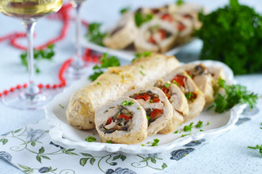 Chicken rolls with mushrooms and cheese in the oven