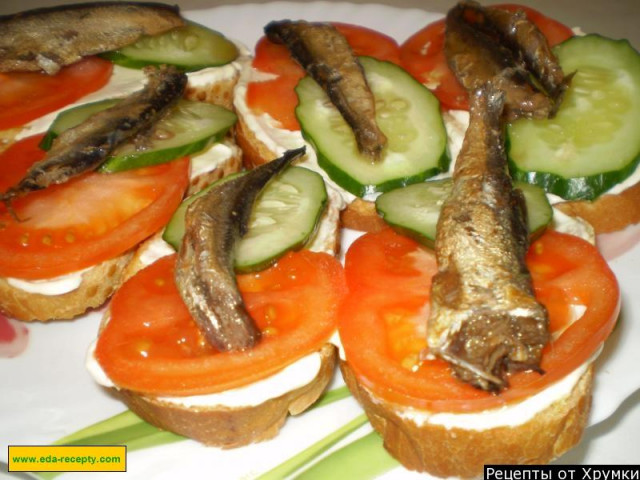 Sandwiches with mayonnaise sprats tomato and cucumber