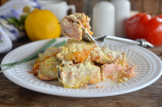 Pink salmon stewed with onions and carrots