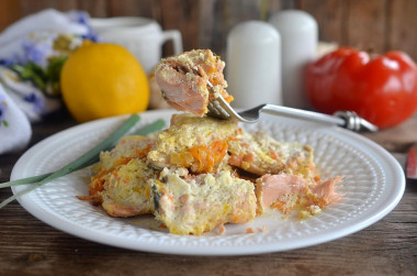 Pink salmon stewed with onions and carrots