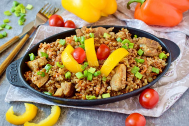 Buckwheat with pork meat in a frying pan