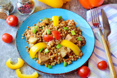 Buckwheat with pork meat in a frying pan