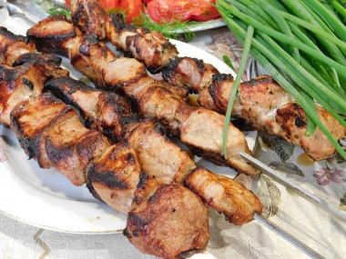 Shish kebab in red wine on the grill