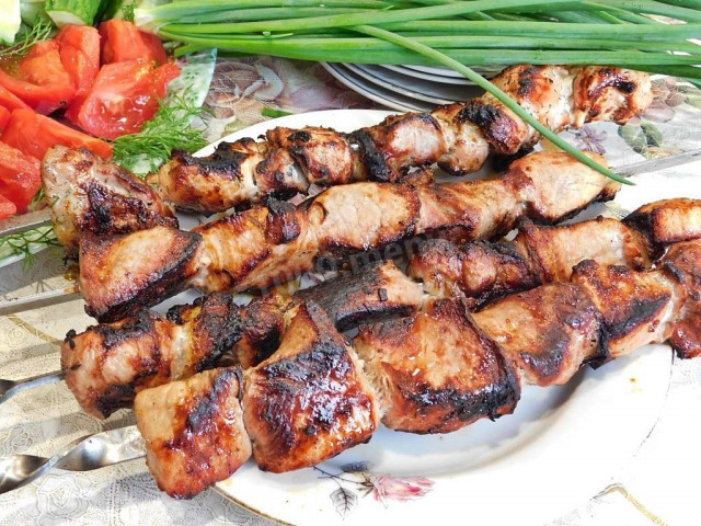 Shish kebab in red wine on the grill