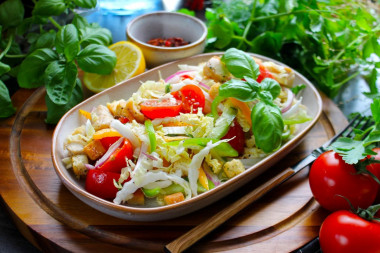 Peking cabbage salad with chicken croutons and tomatoes