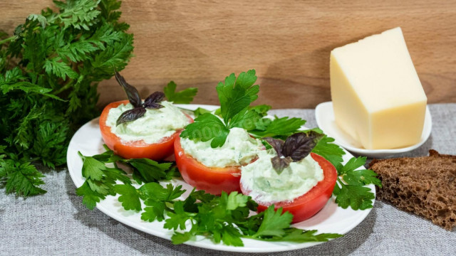 Tomatoes stuffed with cottage cheese sour cream and cheese