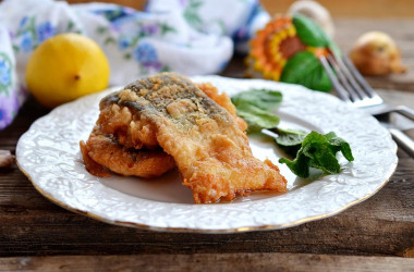 Pink salmon in batter in a frying pan