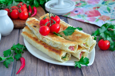 Lavash sausage cheese egg in a frying pan