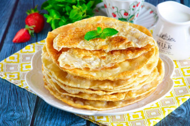 Tortillas on water with an egg in a frying pan