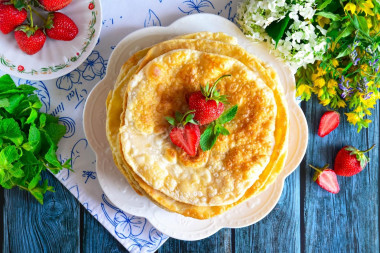 Tortillas on water with an egg in a frying pan