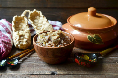 Buckwheat with meat in pots in the oven