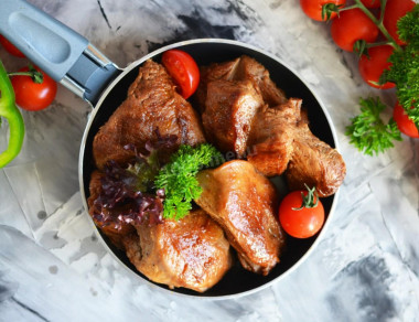 Turkey thigh fillet on frying pan