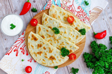 Thin tortillas in a frying pan made of dough with filling