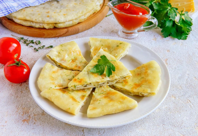 Tortillas with cottage cheese and cheese in a frying pan