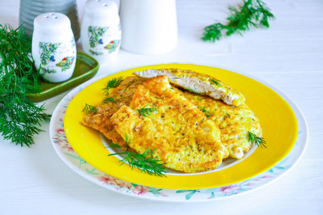 Turkey in batter in a frying pan