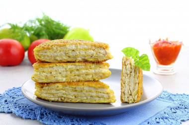 Waffle cakes with minced meat in a frying pan