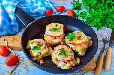 French-style meat in a frying pan with potatoes pork