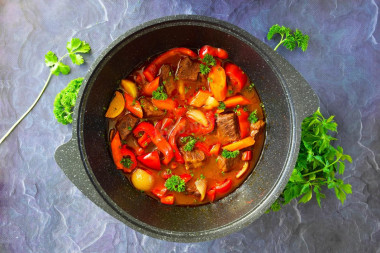 Beef with vegetables in a cauldron