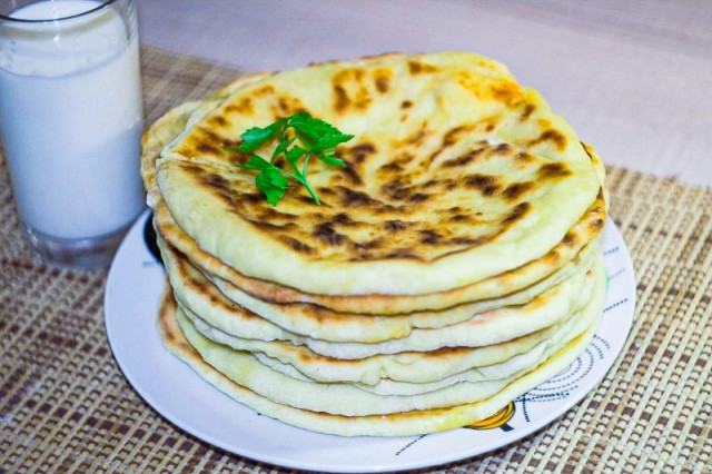 Khachapuri without yeast with cheese in a frying pan