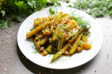 Zucchini with soy sauce and garlic in a frying pan