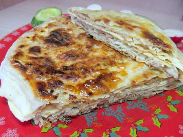 Tortillas with minced meat in a frying pan