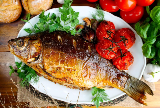 Whole stuffed carp baked in the oven