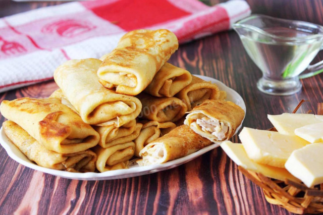 Pancakes with chicken, mushrooms and cheese
