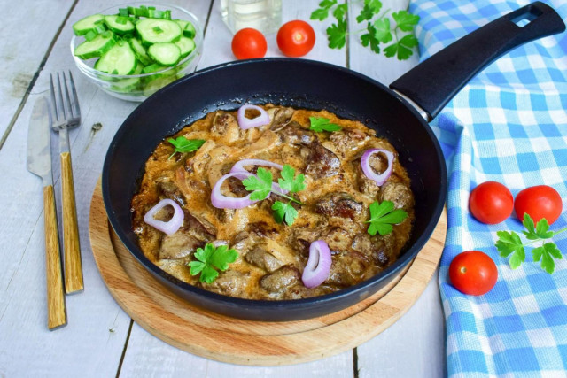 Chicken liver in a frying pan with mayonnaise